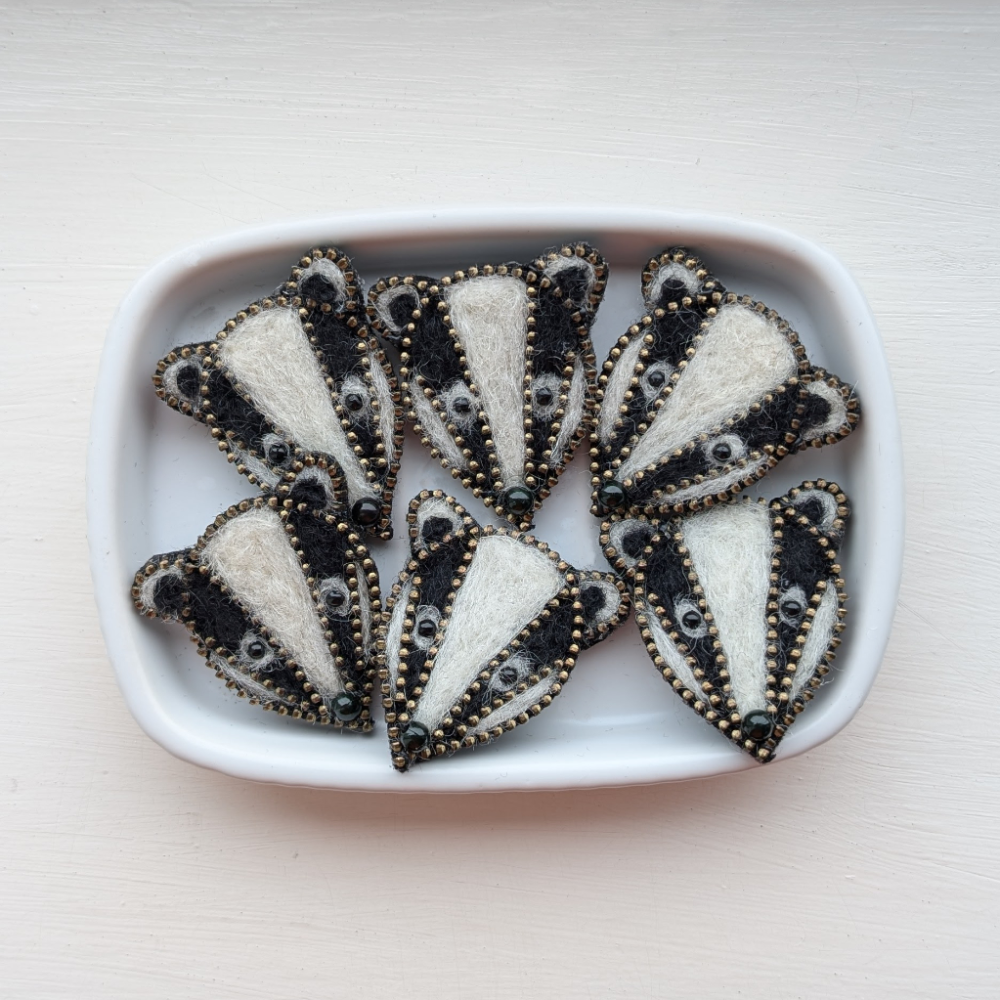Badger brooches