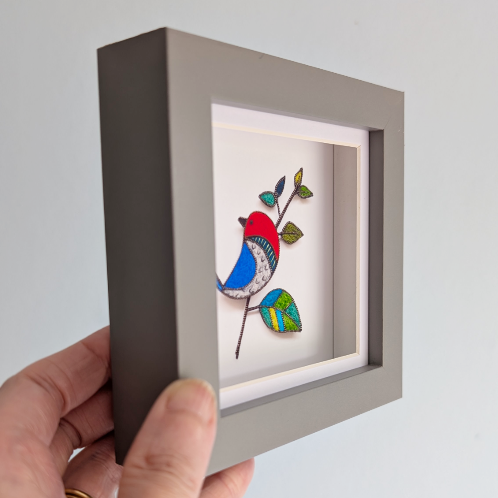 Preening Bird grey frame side