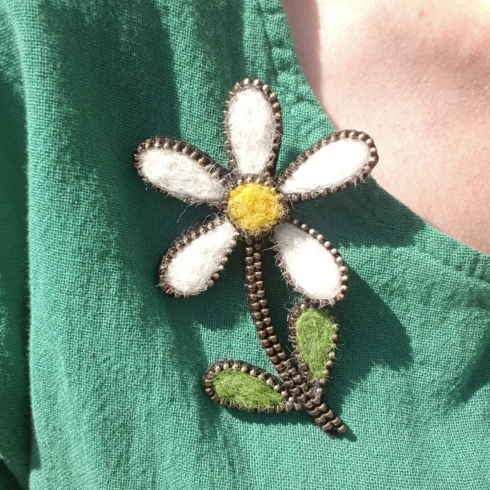 Statement daisy brooch top